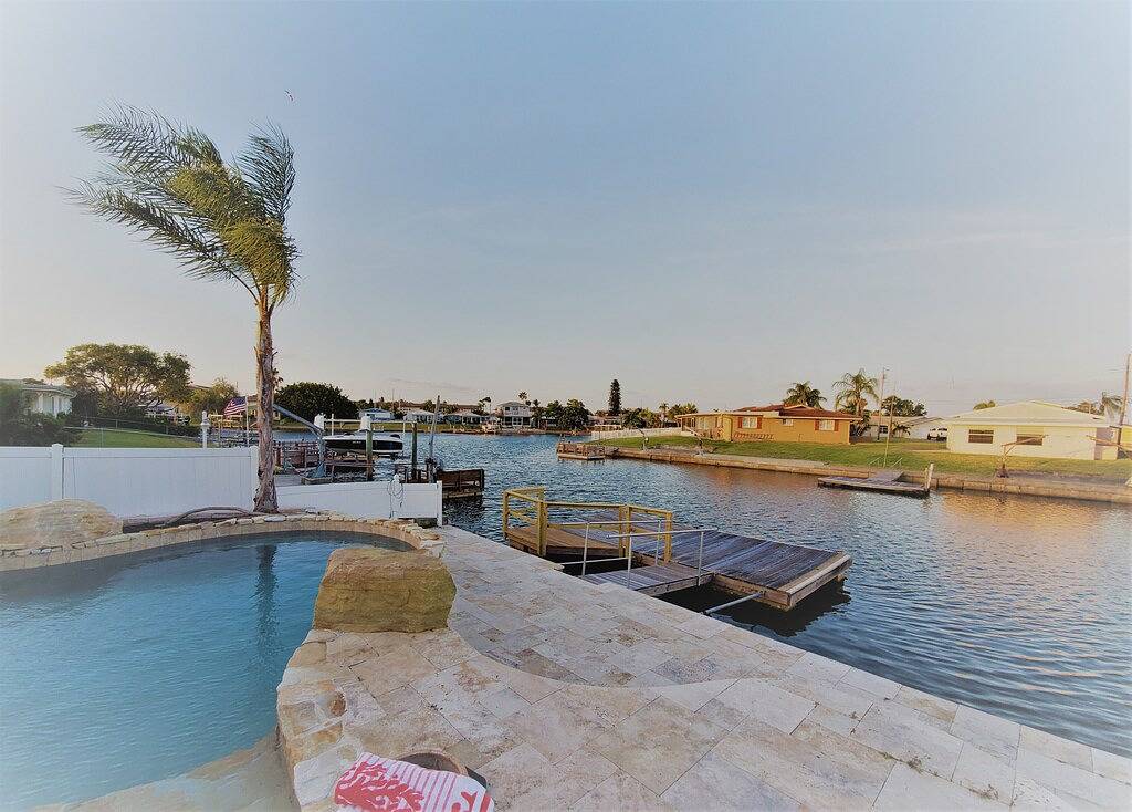 Gulf of Mexico Canal Cottage with Boat Dock and Heated Pool in Pasco County