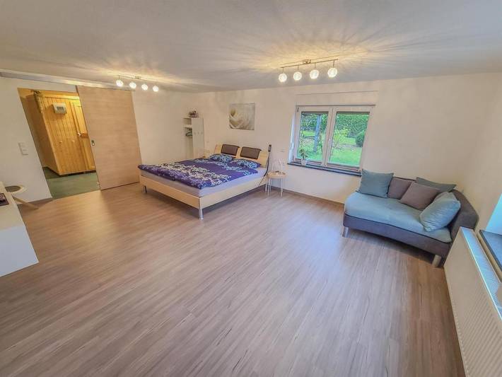 Ferienwohnung für 3 Personen, mit Terrasse und Garten sowie Sauna