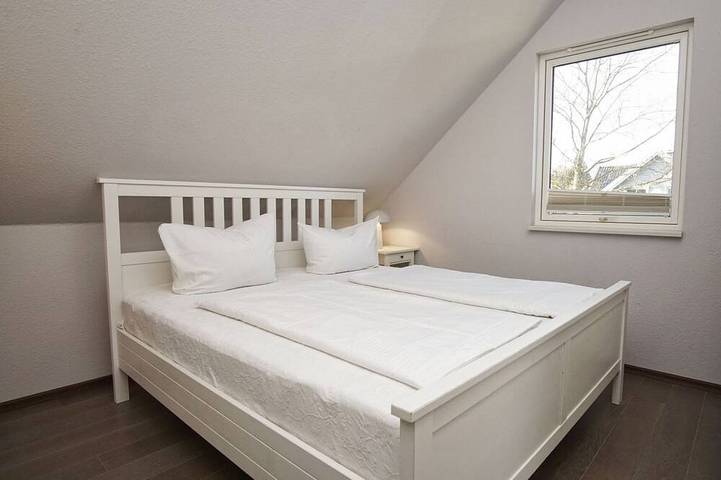 Haus Sternschnuppe—a cozy house with a fireplace, sauna, garden, and patio— in Wiek, Ruegen