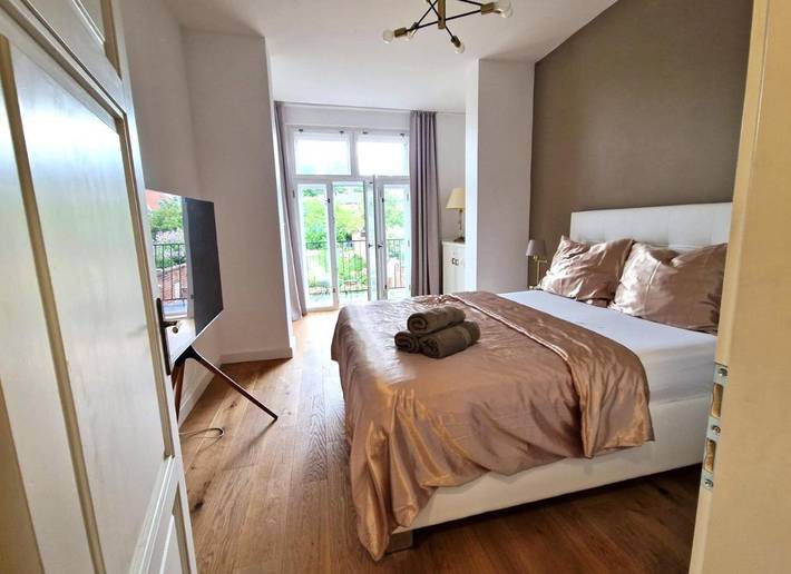Appartement de vacances pour 3 personnes, avec vue ainsi que jardin et balcon