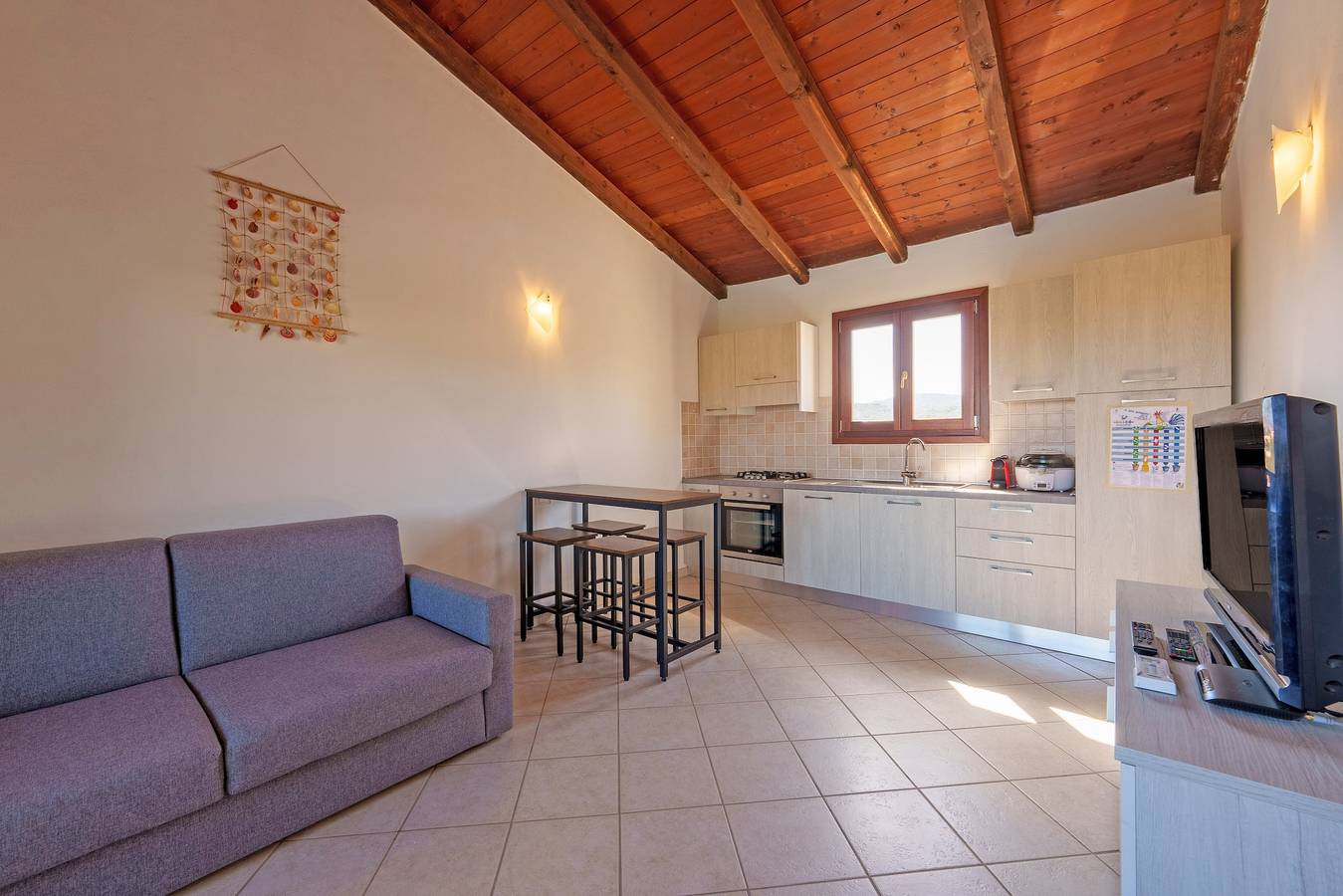 Appartamento intero, Appartamento di vacanza "Cocco" con piscina condivisa, terrazza privata e balcone in Porto San Paolo, Loiri Porto San Paolo