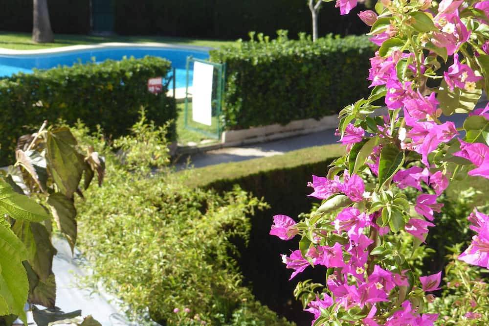 Cozy house, right on the beach and on the golf course in a quiet urbanization in Oliva, Costa Blanca