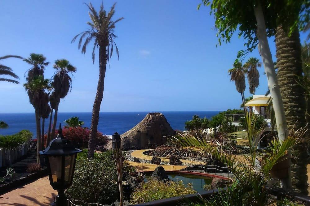 Apartamento entero, Estudio con aire acondicionado, piscina, vistas al mar, Wi-Fi, Reino Unido e Irlanda Tv + deportes in Puerto del Carmen, Tías