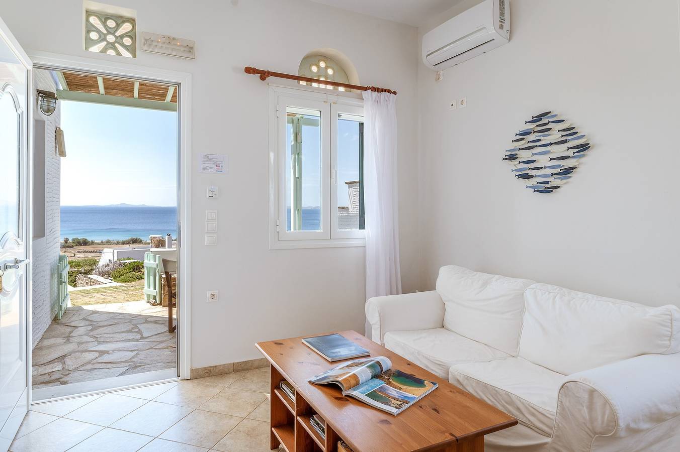 Casa de férias 'Anemologio 102 Tinos' com vista para o mar, Wi-Fi e ar condicionado in Ormos Agiou Ioannou, Tinos