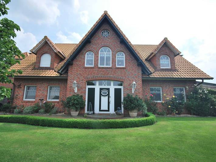 Ferienwohnung für 2 Personen, mit Seeblick und Balkon sowie Garten in Uplengen
