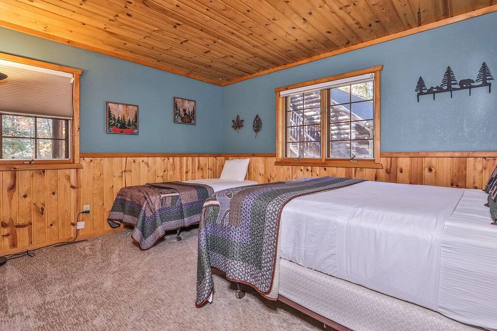 Dog-friendly, lakefront lodge in the woods with large dock, central Ac, & canoe in Vilas County