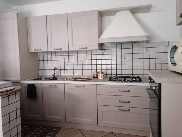 "Casa Vacanze Bau Mela". Vista sulle montagne e giardino in comune in Villanova Strisaili, Villagrande Strisaili