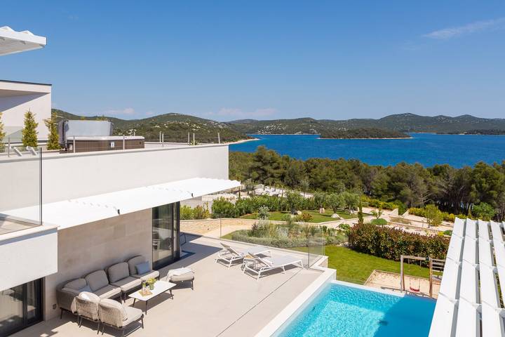 Villa for 9 people, with Balcony and Balcony/Terrace as well as Terrace and Sauna in Tisno
