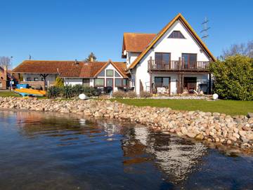 Hotel für 3 Personen, mit Balkon und Garten sowie Ausblick und Seeblick, mit Haustier in West Rügen