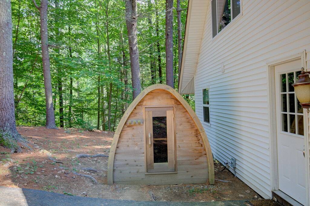 Serene getaway with private sauna, firepit, deck, grill, balcony, & washer/dryer in Gilford, Lake Winnipesaukee