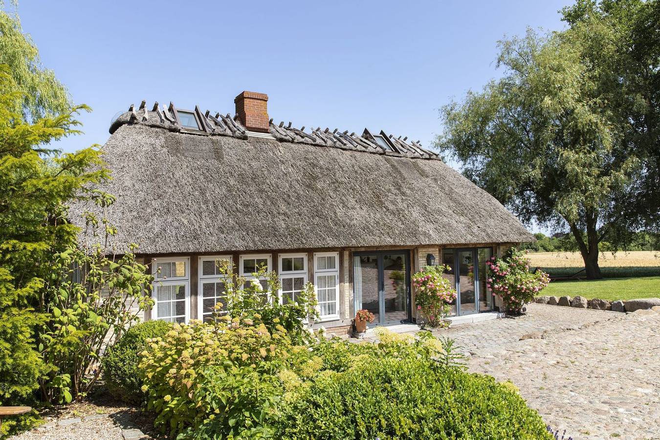Urgemütliche Reetdachkate mit großem Kamin und Sauna in Geltinger Birk, Pommerby