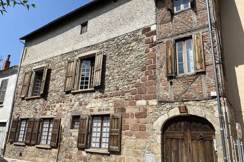 At Home... at Chez vous in the 15th-16th century Chanoinerie in Brioude, Macizo Central