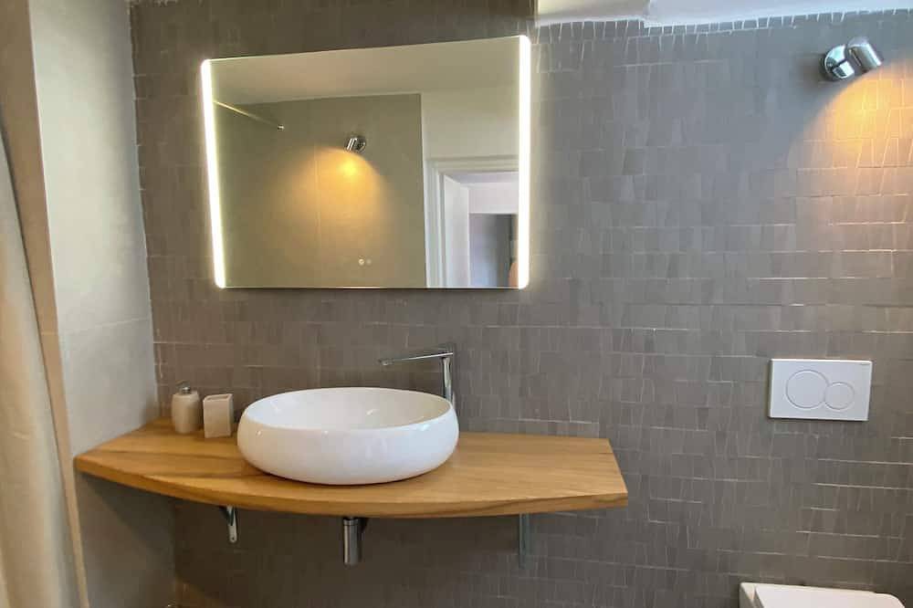 In the hills of the Italian Riviera, a fully renovated 47-square-meter loft in Noli, Riviera di Ponente