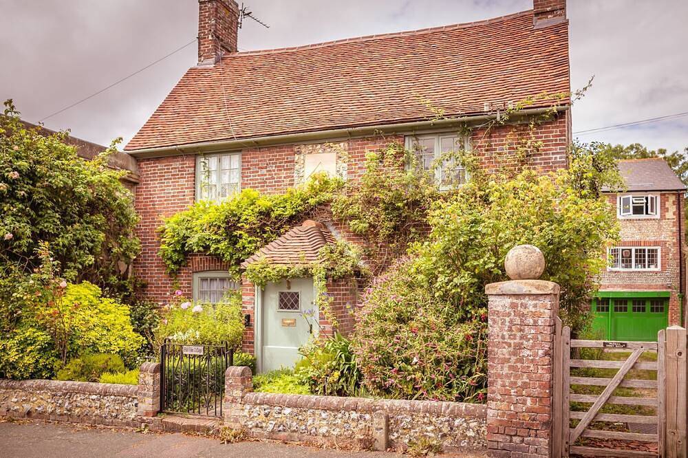 Chocolate-box pretty Pear Tree Cottage in South Downs village in Eastbourne, Sussex Oriental