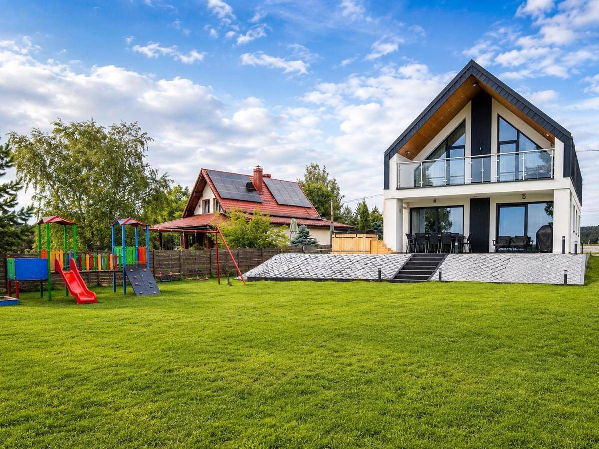 Nad Samą Wodą Villa Luksusowy dom nad Jeziorem z prywatnym pomostem i jacuzzi in Pasym, Mazury