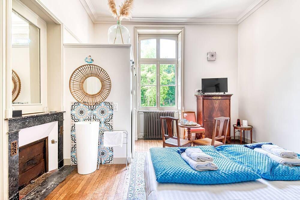 Lavishly decorated double room at Château Le Fresne in Bouchemaine, Angers region