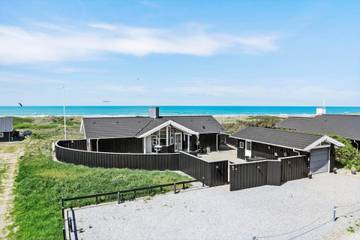Ferienhaus mit Meerblick für 6 Personen, mit Sauna und Whirlpool sowie Terrasse in Grønhøj Strand