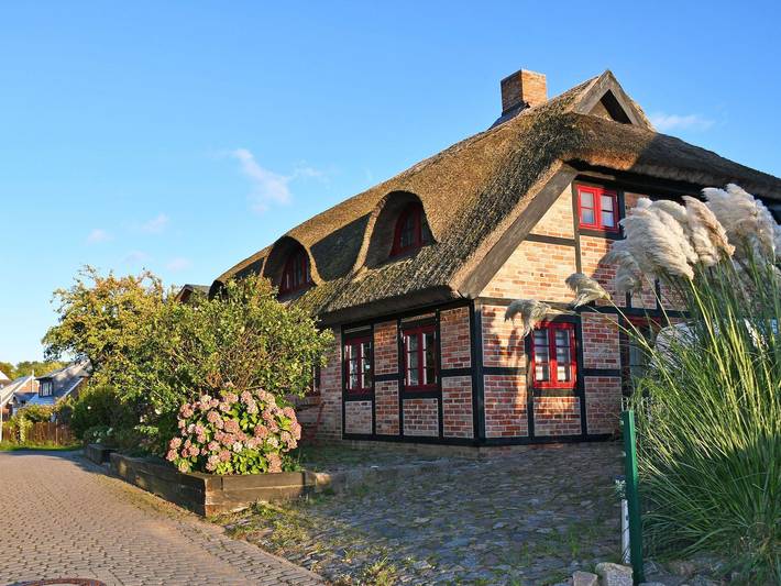 Ferienwohnung für 3 Personen, mit Terrasse und Garten sowie Sauna und Seeblick auf der Halbinsel Mönchgut