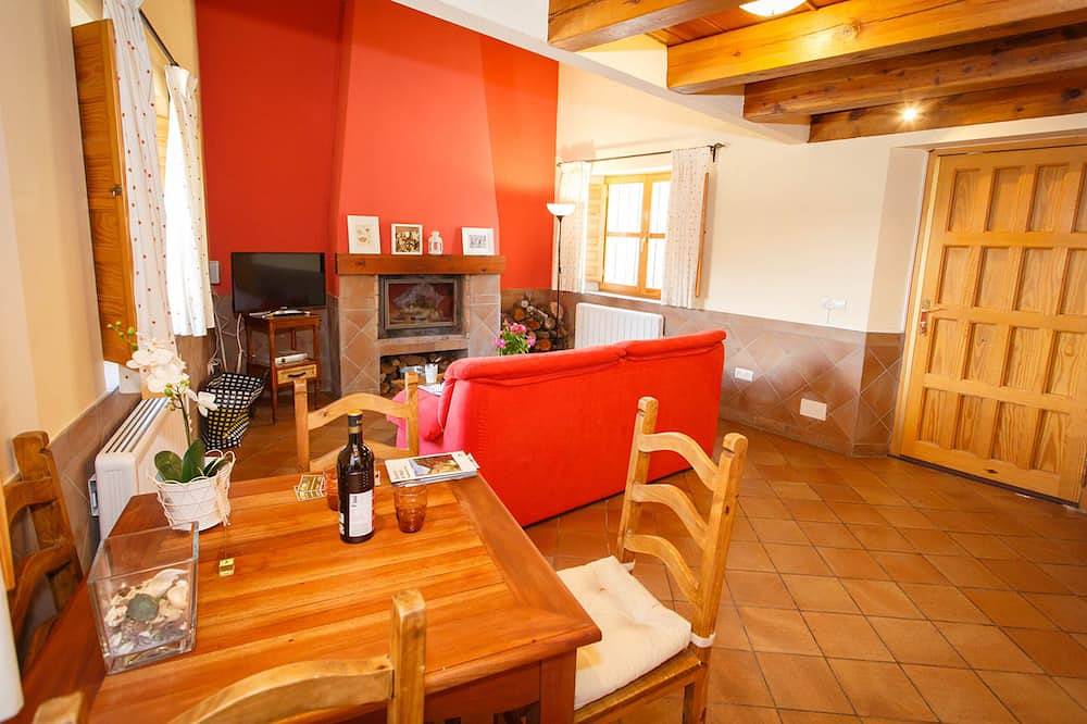 La Fragua is a beautiful little house with a gable roof built in stone and wood in Piñuécar, Madrid Province