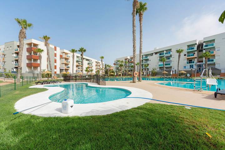 Entire apartment, Premium family apartment in Almerimar with garden and pool views in Almerimar, El Ejido