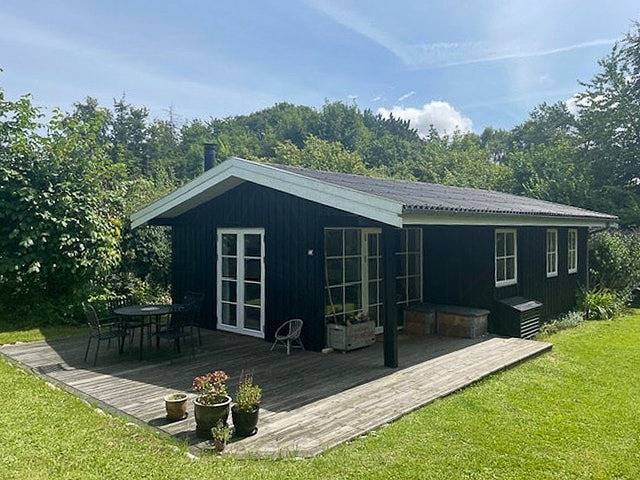 Ferienhaus mit Sonnenuntergang über der Sejerø-Bucht in Veddinge, Asnæs