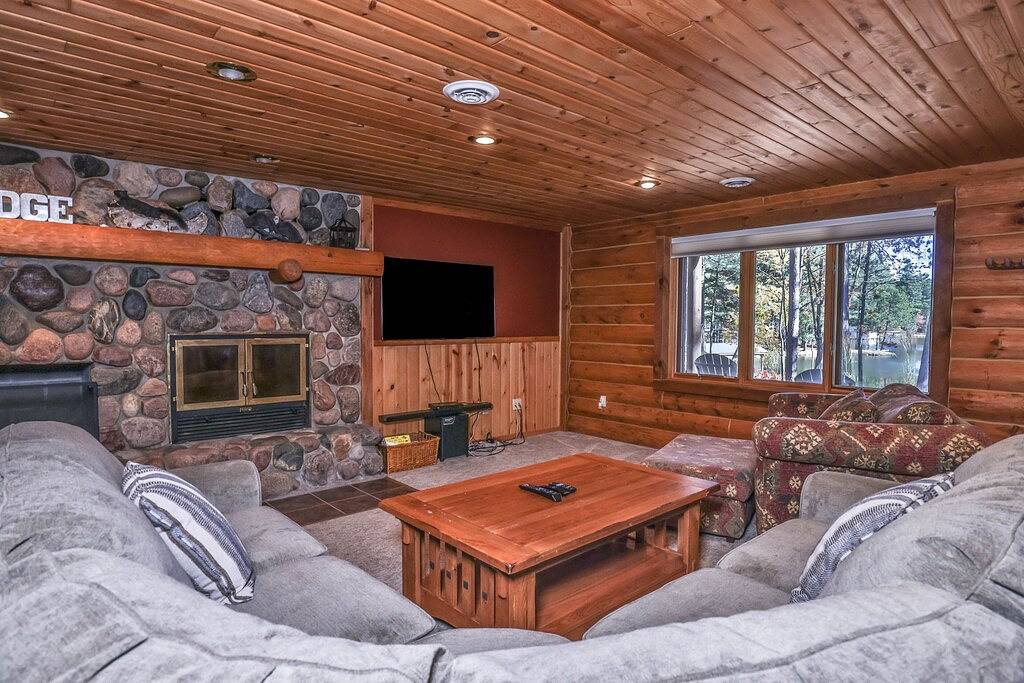 Dog-friendly, lakefront lodge in the woods with large dock, central Ac, & canoe in Vilas County