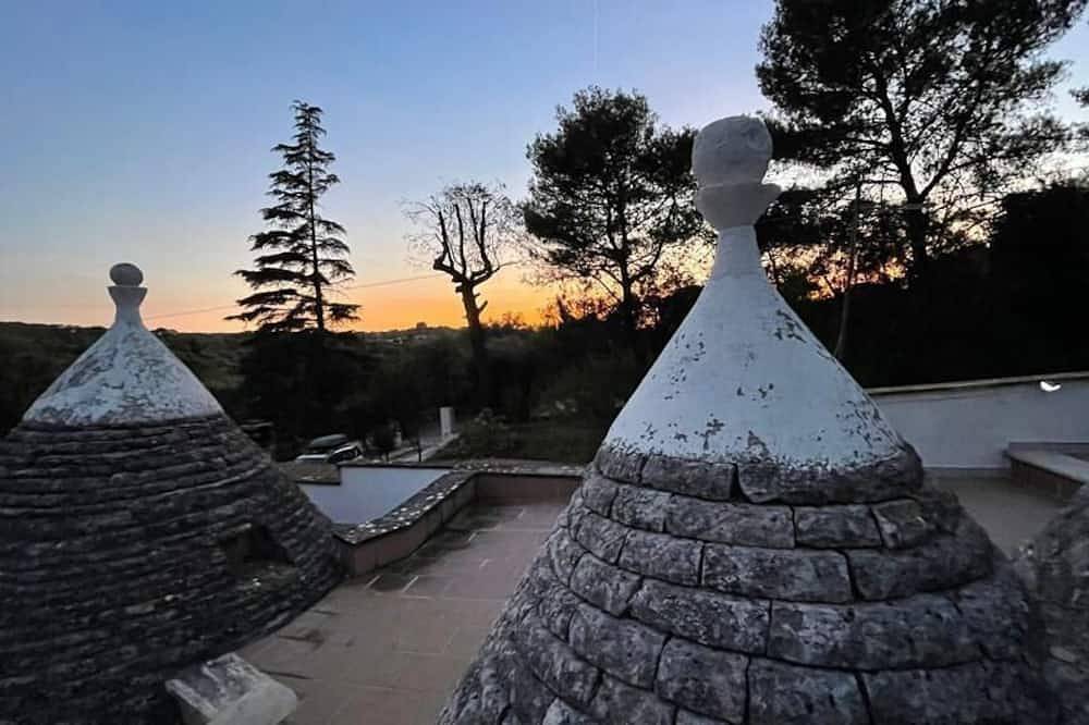 Trulli in the woods of the valley of Itria in Salento
