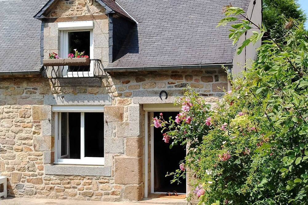 Typical Breton house with garden near the sea and the Bay of Saint Brieuc in Plélo, Côtes-d'Armor