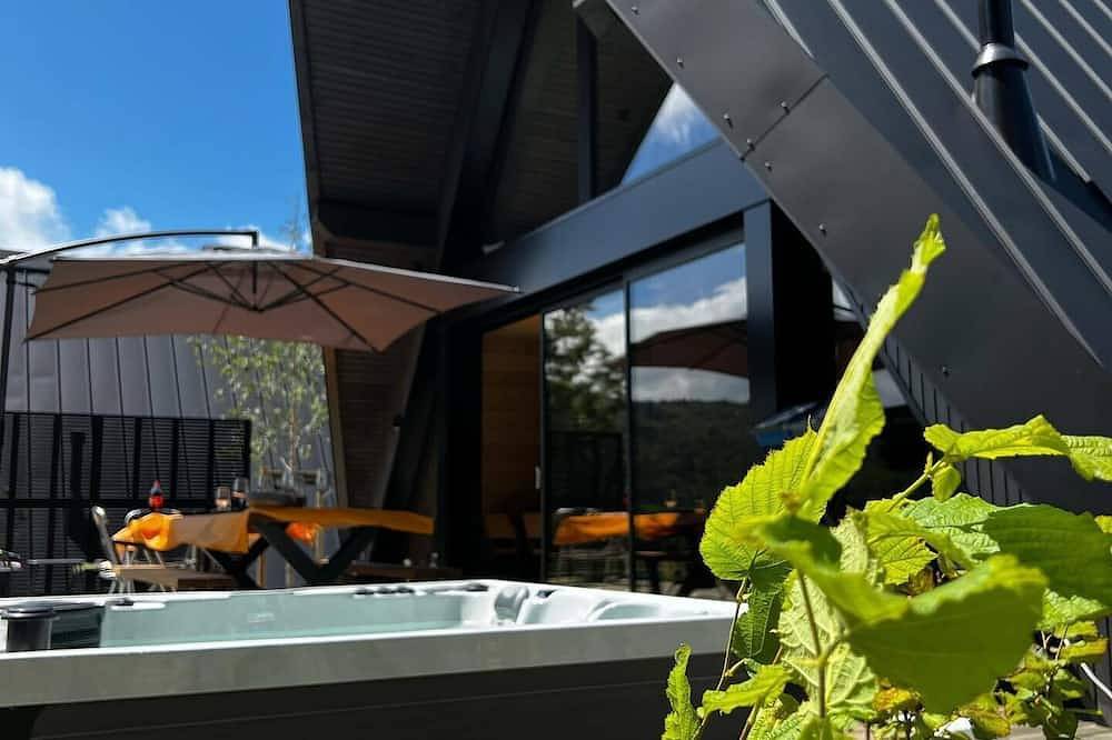 Delta Cottage of 60m² with terrace and Private Spa in Chambon-sur-Lac, Volcans d'Auvergne Regional Nature Park