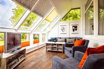 Ferienhaus für 5 Personen, mit Garten und Sauna sowie Terrasse und Seeblick in Wittmund