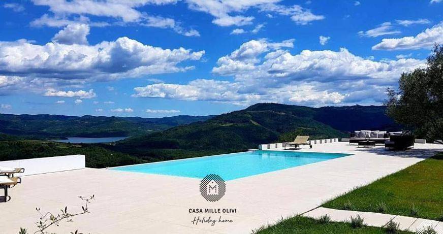 Ferienhaus für 4 Personen, mit Garten und Seeblick sowie Ausblick und Pool, mit Haustier
