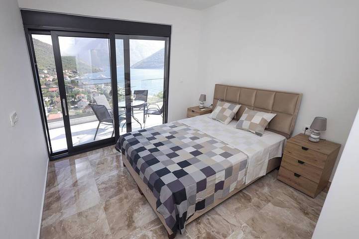 The house is our passion project, built with love surrounded by forest and views in Kamenari, Bay of Kotor
