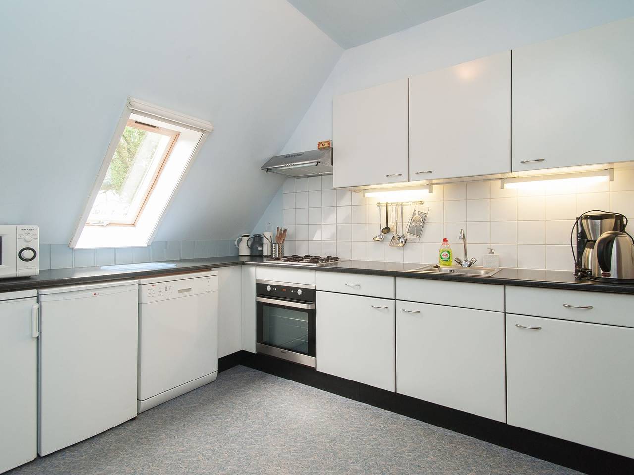 Farmhouse in 't Zand near Windmills in North Sea Netherlands