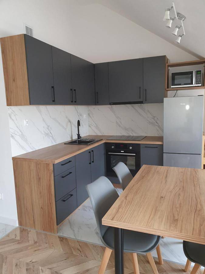 Apartament wakacyjny dla 4 osób, z basen i basen dla dzieci w Sztutowo
