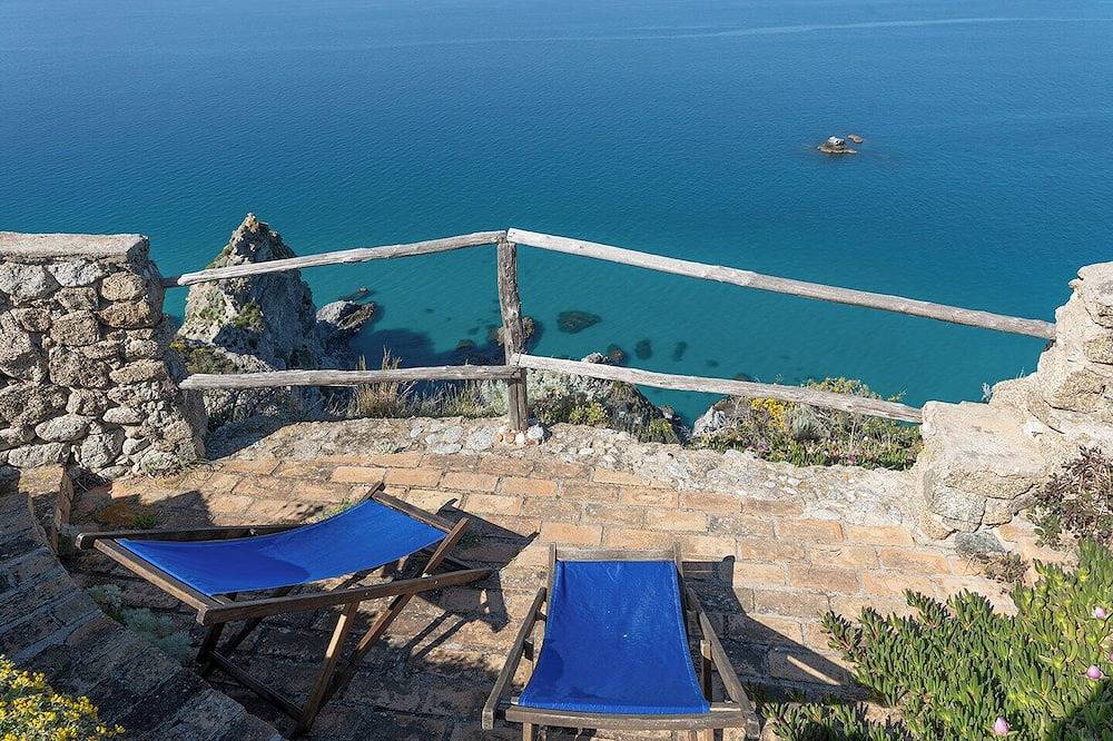 Night on the sea, with see view and stairway to the beach in Faro Capo Vaticano, Vibo Valentia Provinz