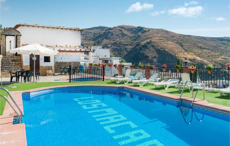 Paraíso junto a la piscina: Apartamento de 65 m2 con aparcamiento y terraza in Mecina Bombarón, Alpujarra de la Sierra