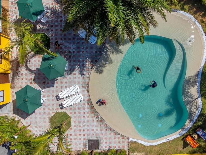 Pousadas para 4 pessoas, com piscina infantil e piscina e ainda vista and jardim em Barra de Pojuca