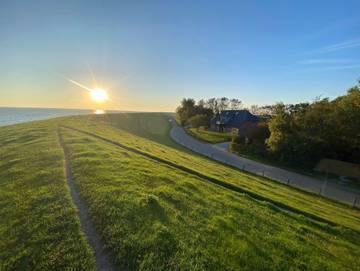 Ferienwohnung für 3 Personen, mit Terrasse und Ausblick sowie Garten, kinderfreundlich in Nordstrand