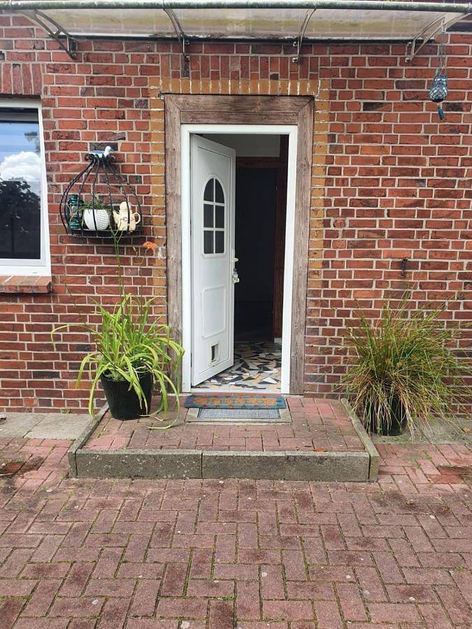 Ferienwohnung für 4 Personen, mit Terrasse und Garten sowie Ausblick in Krummendeich