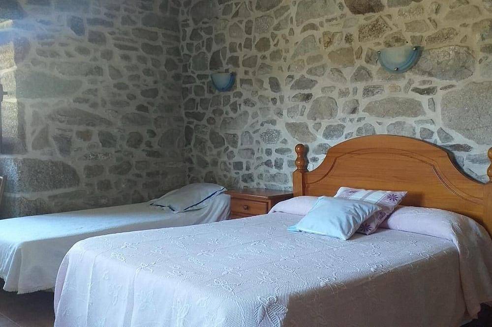 A rustic family home located in a village in Galicia, surrounded by countryside in A Estrada, Pontevedra Province