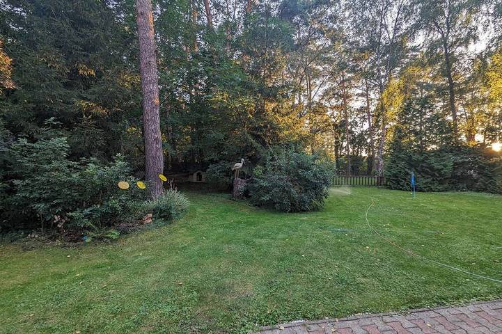 Idyllic wooden dacha with jetty and rowing boat just outside Berlin in Prieros, Heidesee