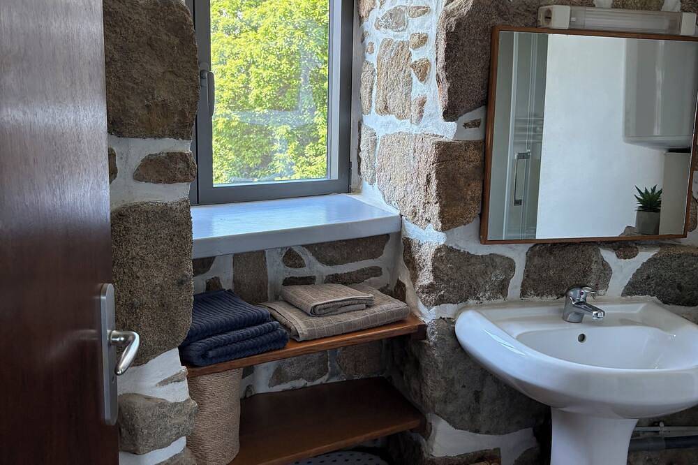 Mill overlooking the sea and the Breton countryside in Lanmodez, Rosa Granitküste