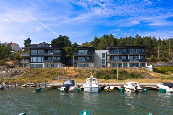 Ferienwohnung für 4 Personen, mit Balkon und Terrasse sowie Garten und Ausblick in Grimstad