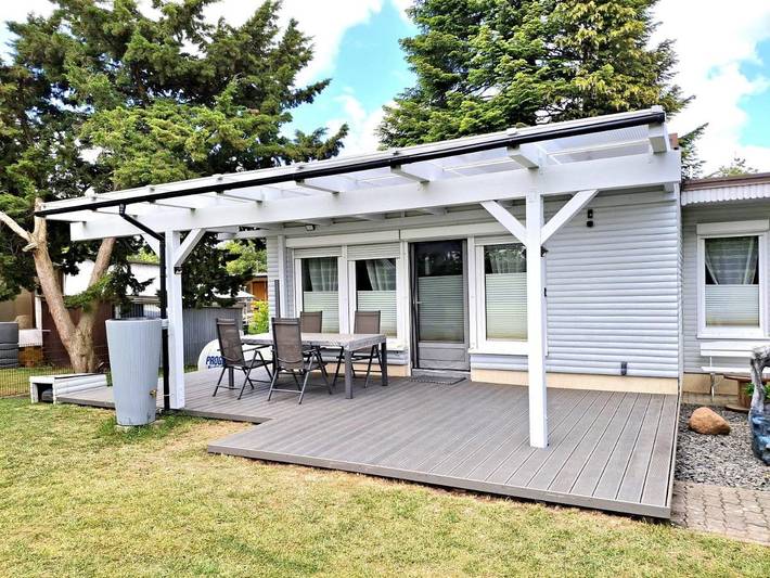Ferienhaus für 4 Personen, mit Terrasse und Garten sowie Seeblick und Ausblick