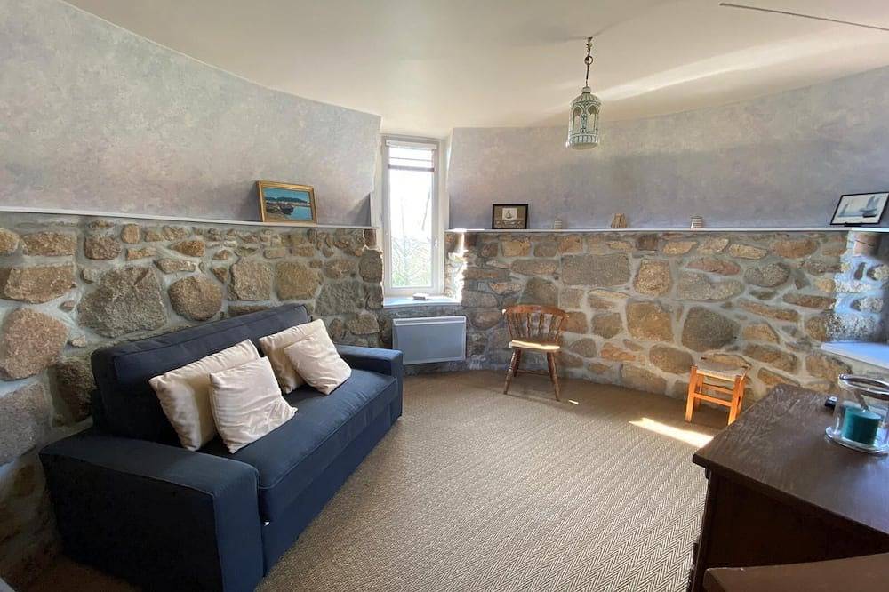 Mill overlooking the sea and the Breton countryside in Lanmodez, Rosa Granitküste