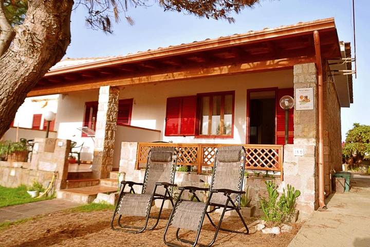 Casa vacanza per 5 persone, con Terrazza e Giardino nonché Piscina per bambini e Piscina a Portoscuso