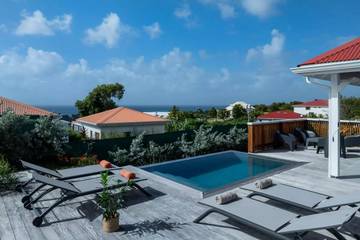 Cottage pour 4 personnes, avec piscine ainsi que vue et jardin à Grand-Bourg