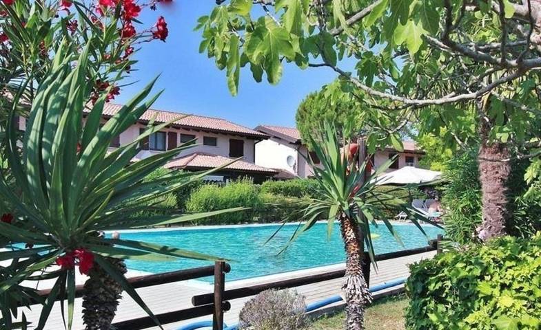 Attico per 3 persone, con giardino e vista lago a Lignano Sabbiadoro
