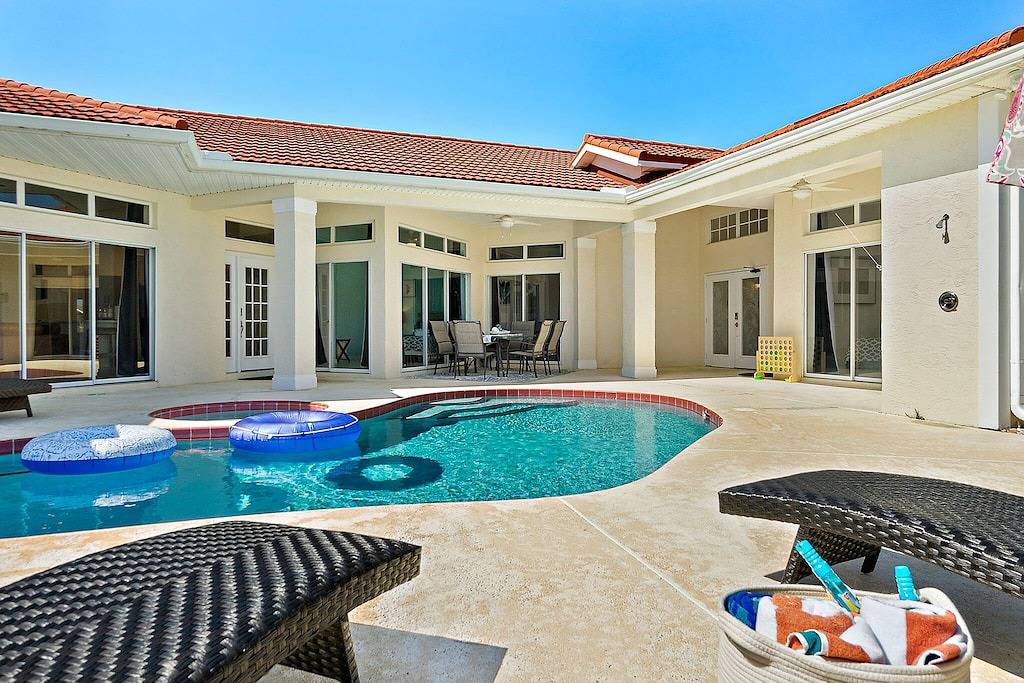 Luxury Courtyard Home w/ Heated Pool/Spa & In-law Suite, 2 Min Walk to Beach! in New Smyrna Beach, Florida