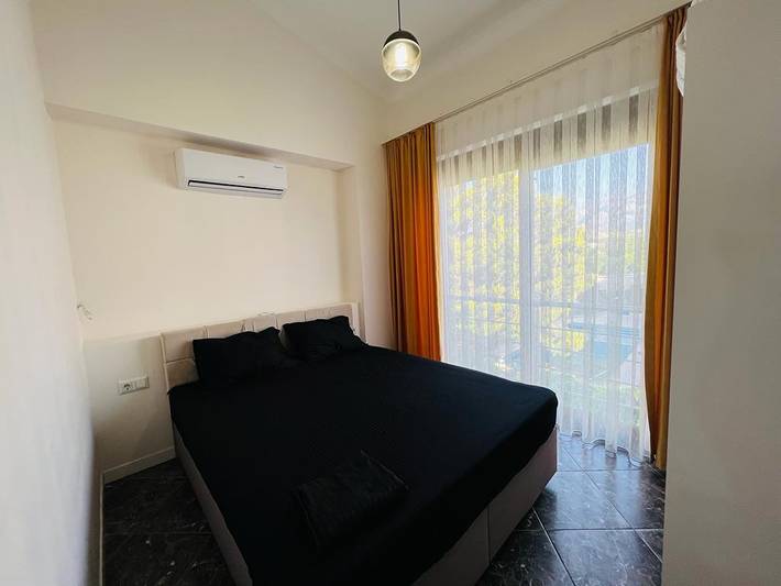 Ganze Wohnung, Barrierefreies Kemer Apartment mit Pool-, Garten- und Bergblick in Kemer, Provinz Antalya